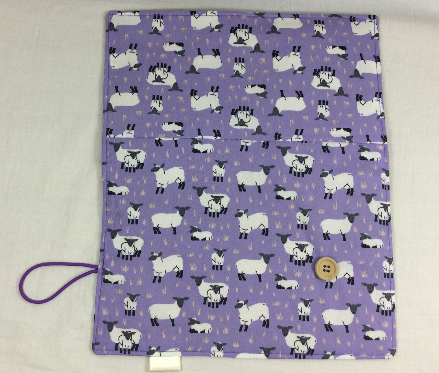 Interchangeable knitting needle case with purple sheep