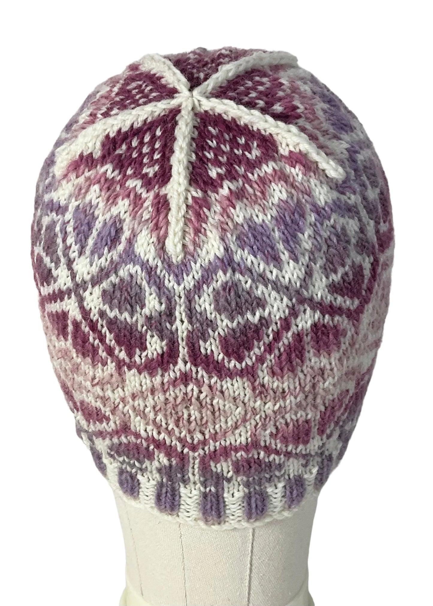 hand knit hat with variegated pink and purple floral motif