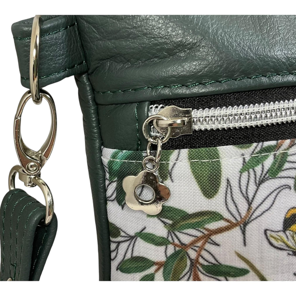 Handbag in genuine soft Cows Leather and water resistant canvas medium sized zip top