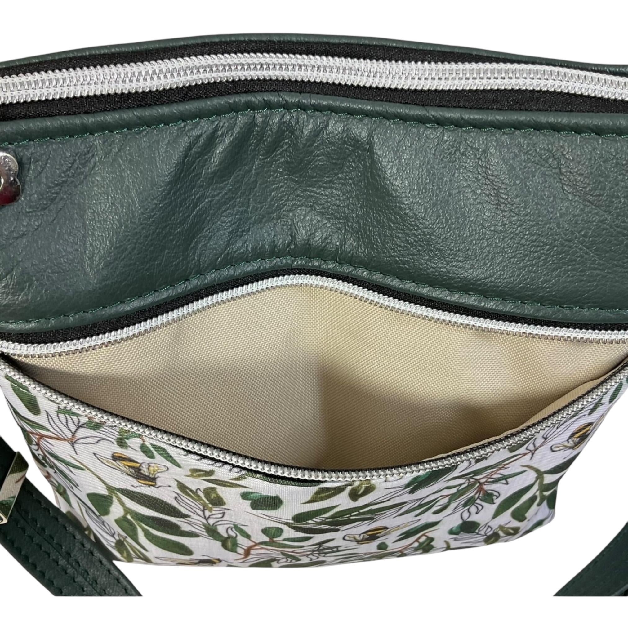 Handbag in genuine soft Cows Leather and water resistant canvas medium sized zip top