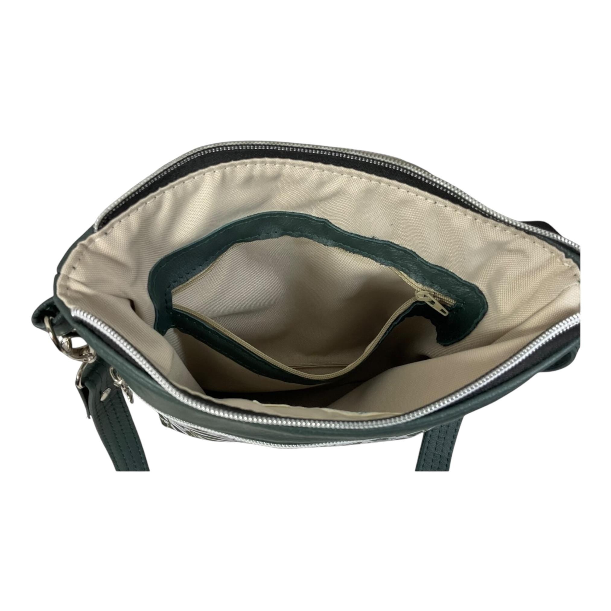 Handbag in genuine soft Cows Leather and water resistant canvas medium sized zip top