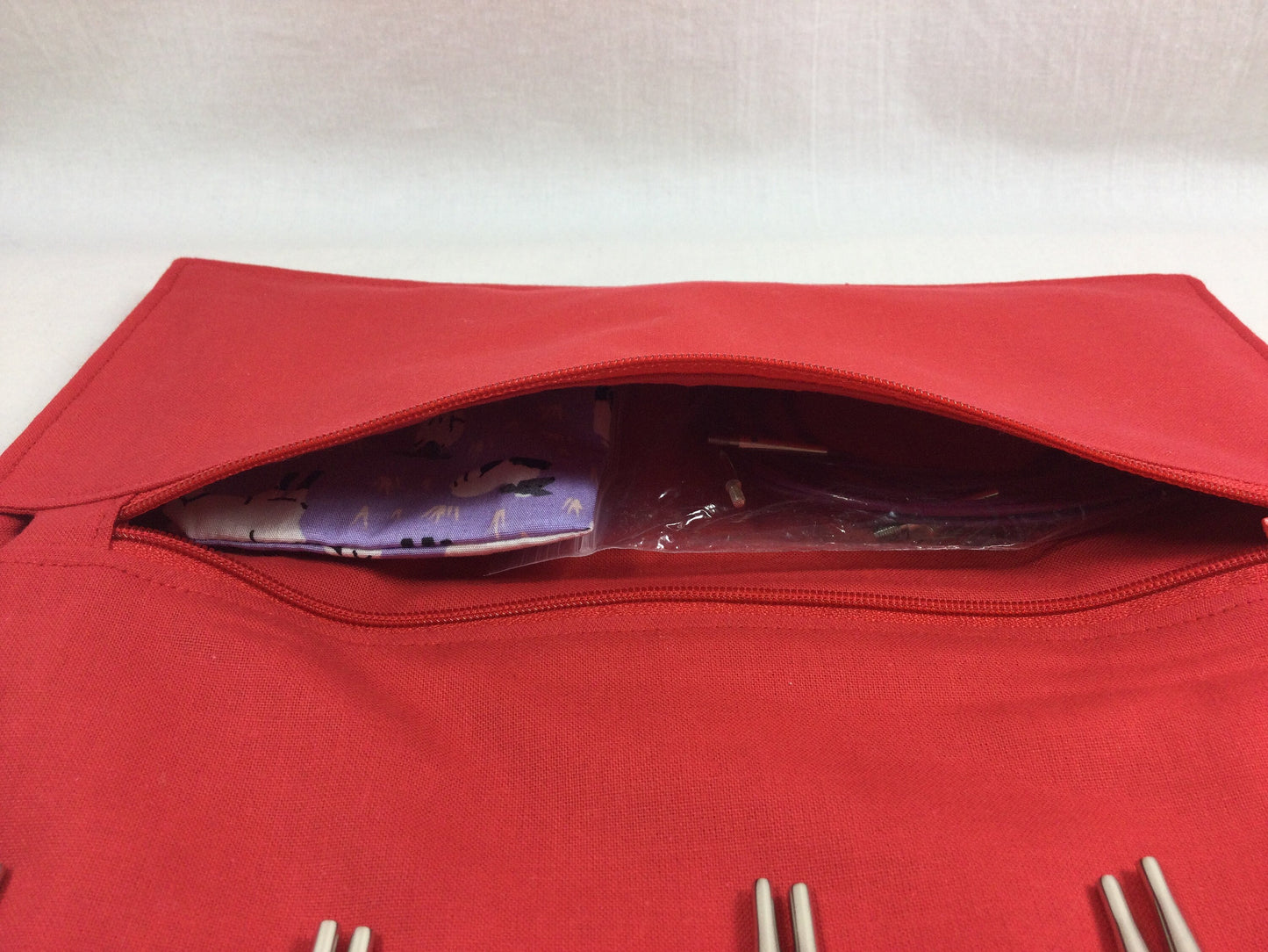 Interchangeable knitting needle case with purple sheep