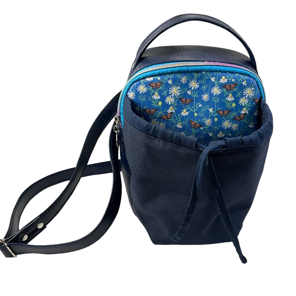 Water bottle sling bag,  walking tour and travel day trip,  floral butterfly bag with carry handle, water resistant vinyl/ faux leather bag