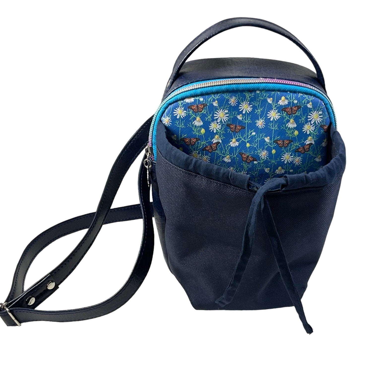 Water bottle sling bag,  walking tour and travel day trip,  floral butterfly bag with carry handle, water resistant vinyl/ faux leather bag