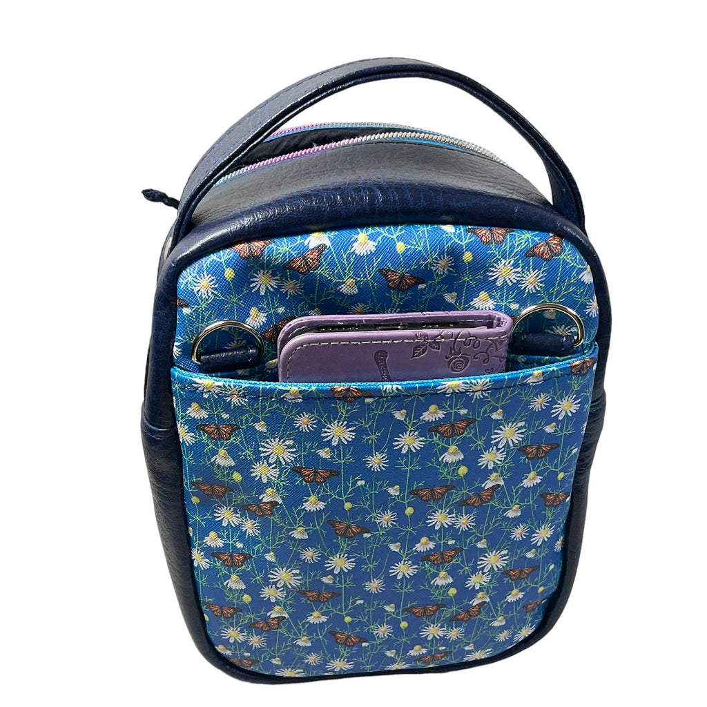 Water bottle sling bag,  walking tour and travel day trip,  floral butterfly bag with carry handle, water resistant vinyl/ faux leather bag