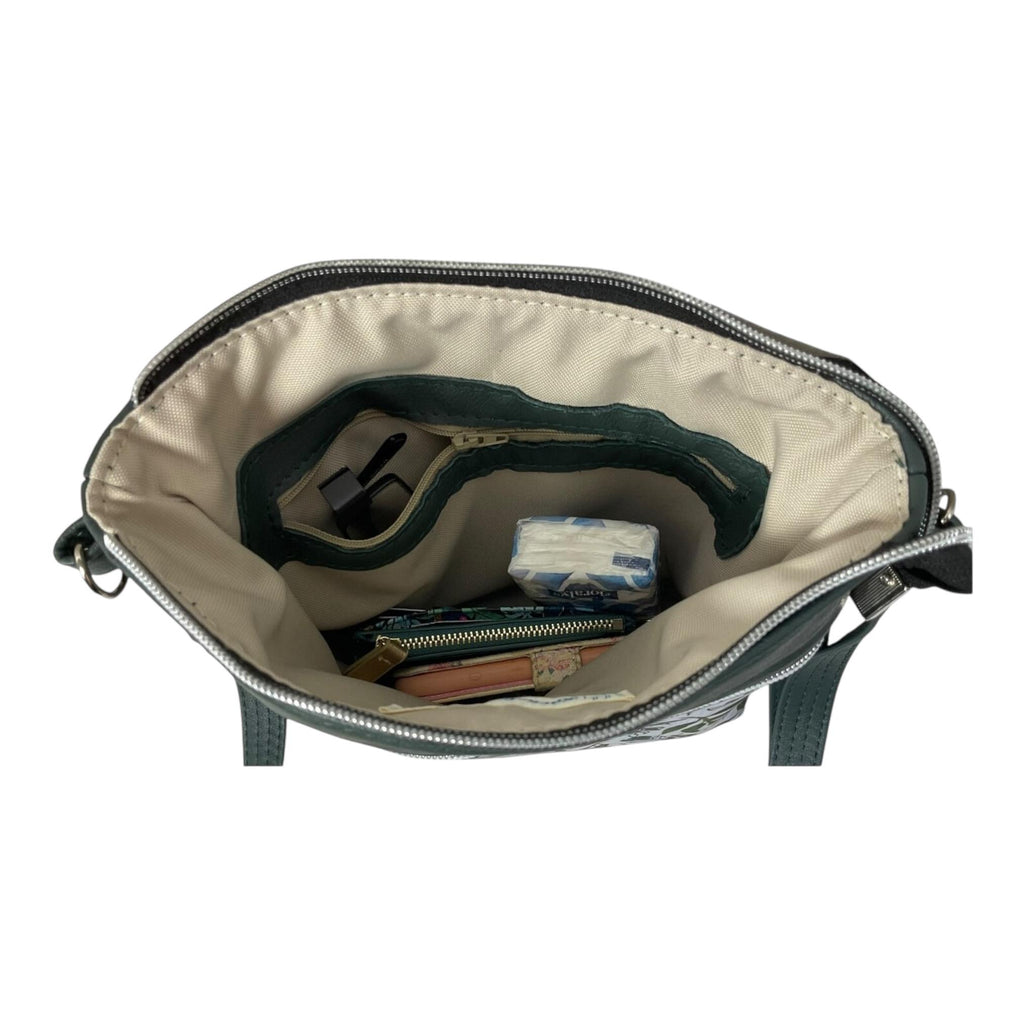 Handbag in genuine soft Cows Leather and water resistant canvas medium sized zip top