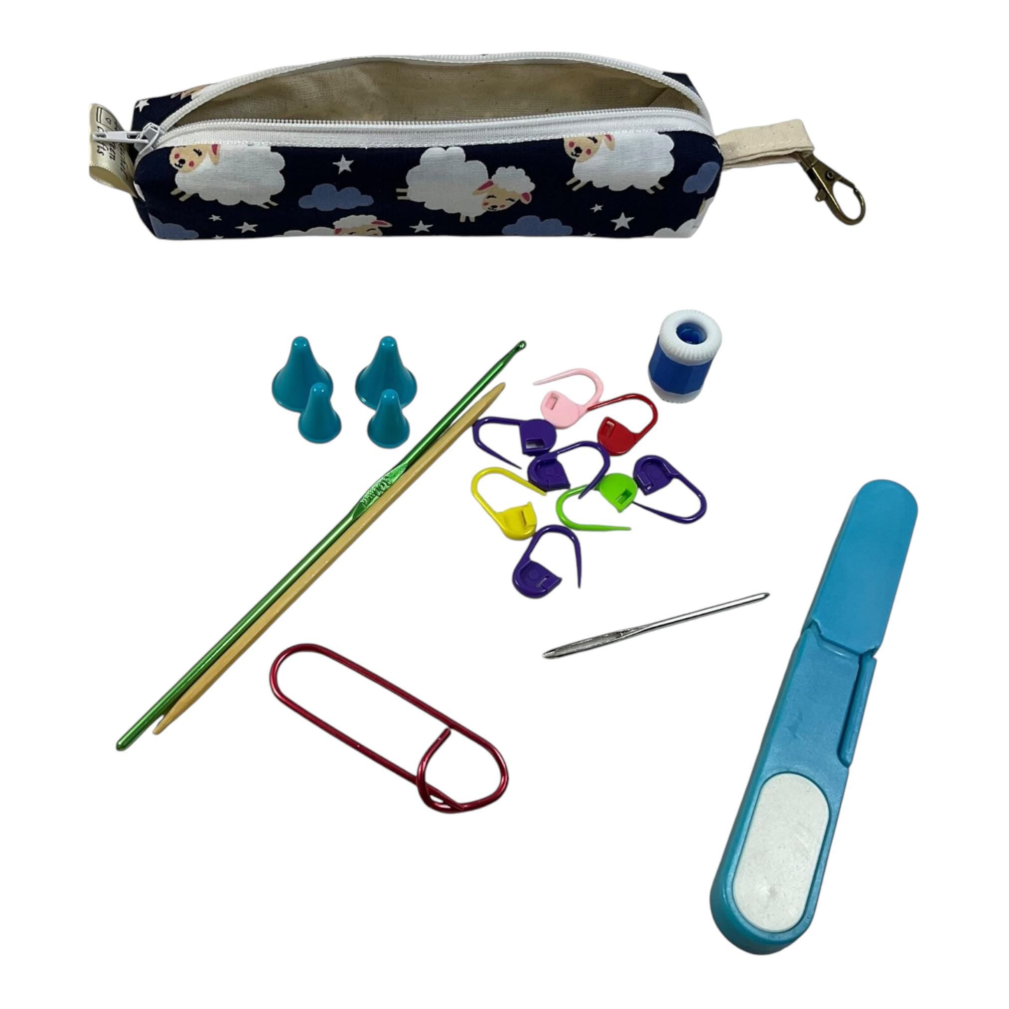 Knitting and crochet travel notions kit filled with accessories,  handy clip on knit bag travel kit, stitch markers, travel scissors,