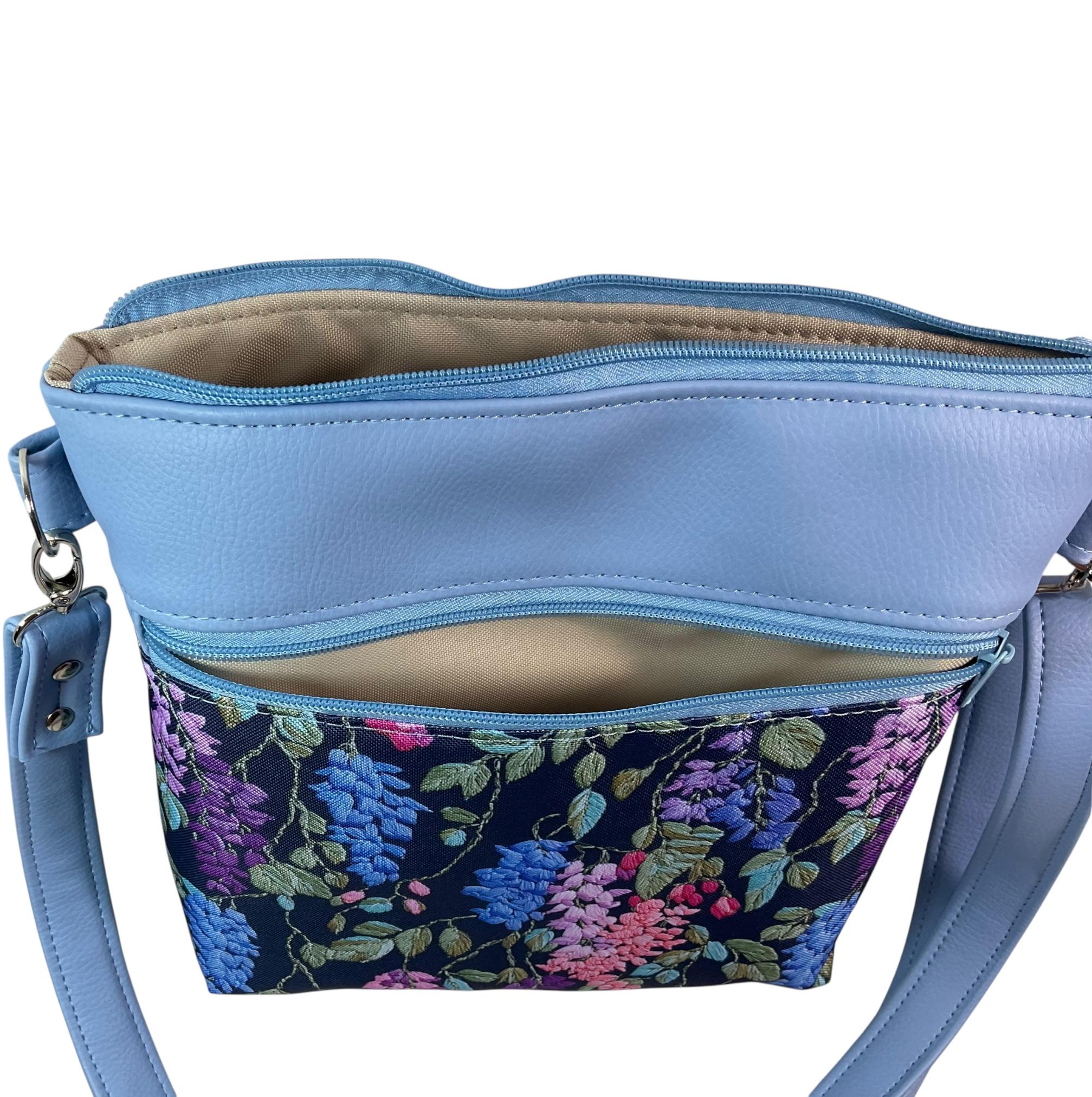Handbag in faux Leather and floral wisteria print  fabric, medium sized zip top shoulder crossbody