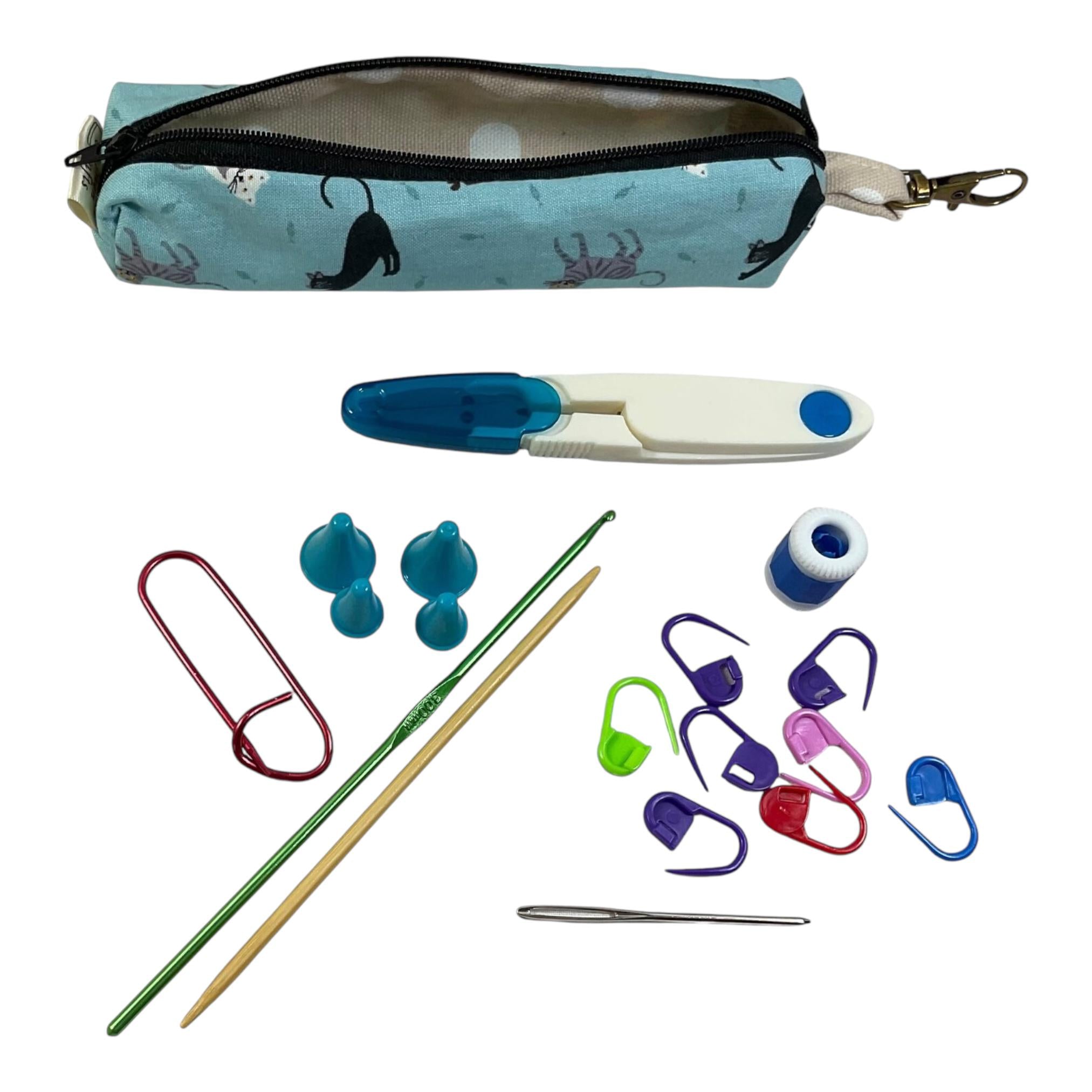 Knitting and crochet travel notions kit filled with accessories,  handy clip on knit bag travel kit, stitch markers, travel scissors,