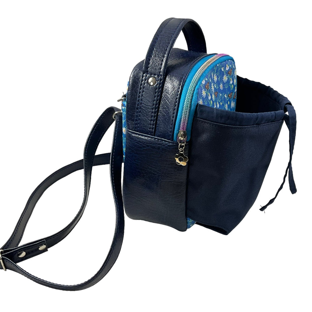 Water bottle sling bag,  walking tour and travel day trip,  floral butterfly bag with carry handle, water resistant vinyl/ faux leather bag