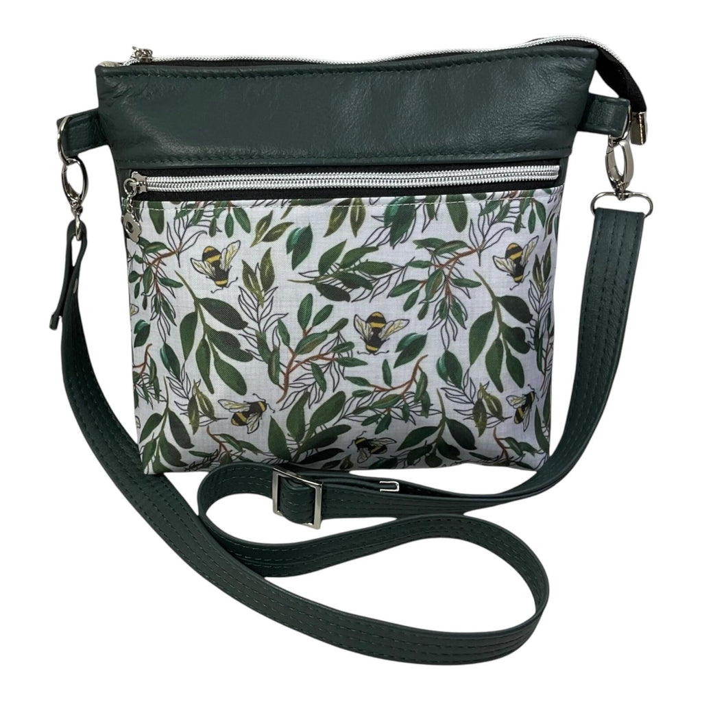 Handbag in genuine soft Cows Leather and water resistant canvas medium sized zip top