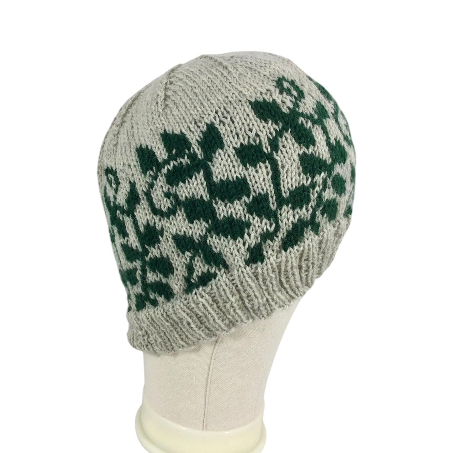 hand knit hat with green and grey floral leaf motif