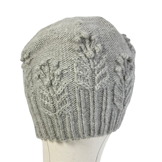 hand knitted cable and bobble hat in silver grey