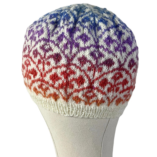 Floral Fairisle hand knitted hat in variagated red and purple yarn