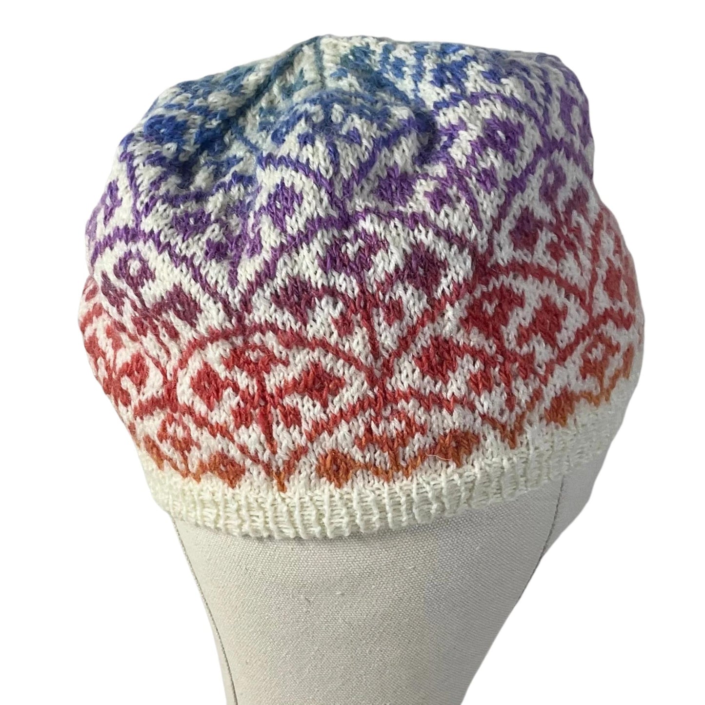 Floral Fairisle hand knitted hat in variagated red and purple yarn