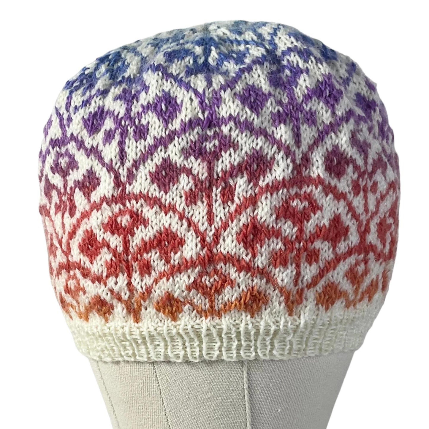 Floral Fairisle hand knitted hat in variagated red and purple yarn