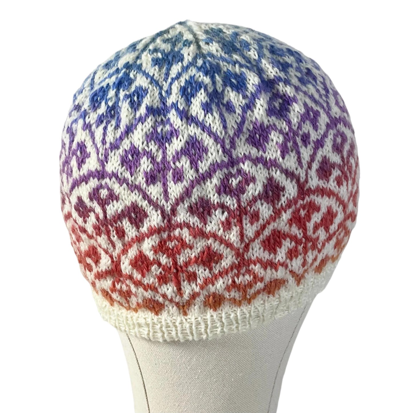 Floral Fairisle hand knitted hat in variagated red and purple yarn