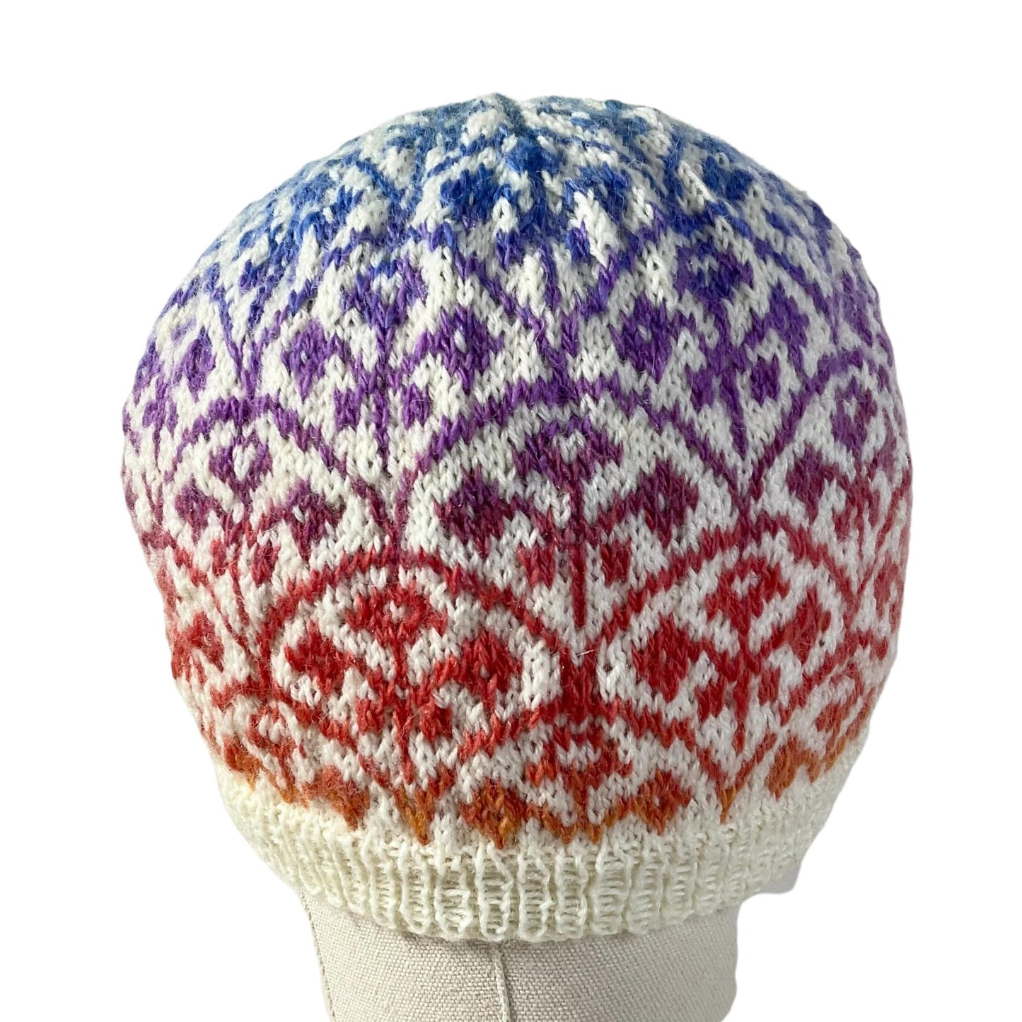 Floral Fairisle hand knitted hat in variagated red and purple yarn