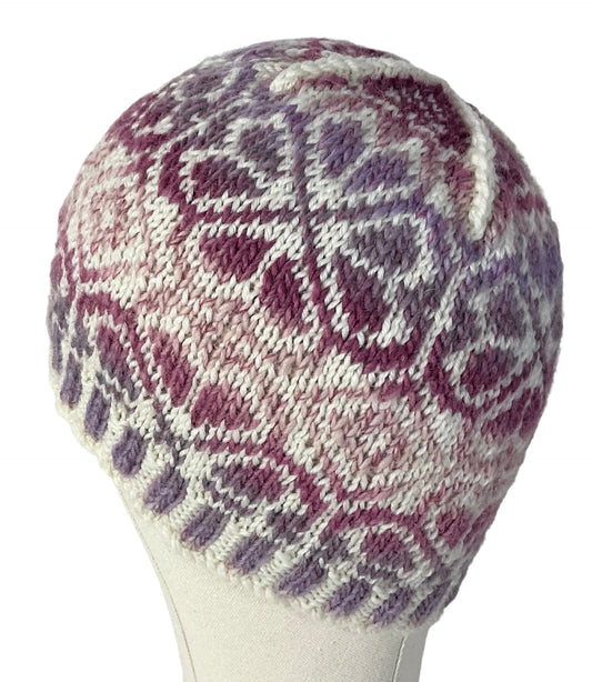 hand knit hat with variegated pink and purple floral motif