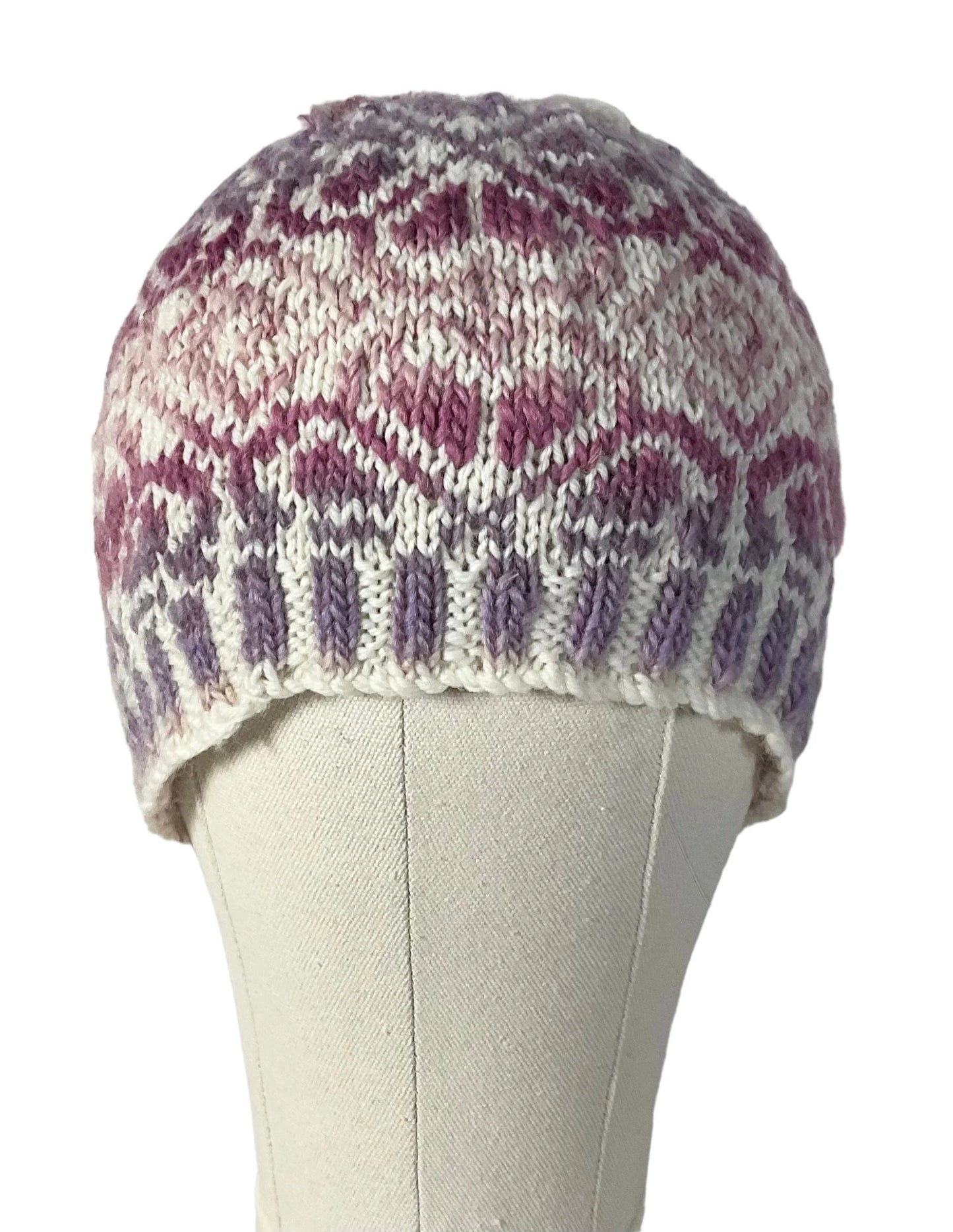 hand knit hat with variegated pink and purple floral motif