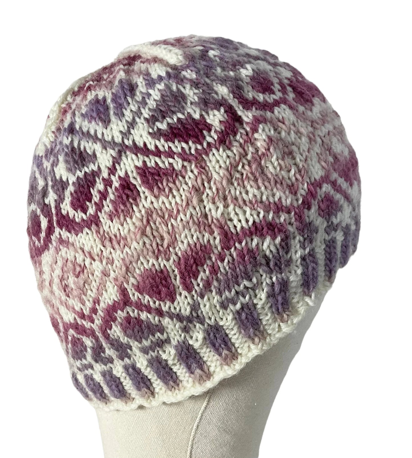 hand knit hat with variegated pink and purple floral motif