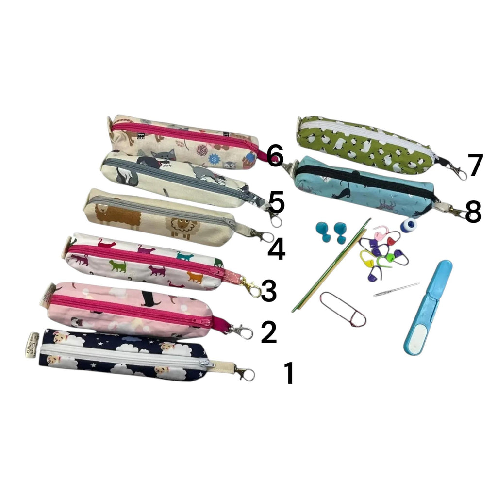 Knitting and crochet travel notions kit filled with accessories,  handy clip on knit bag travel kit, stitch markers, travel scissors,