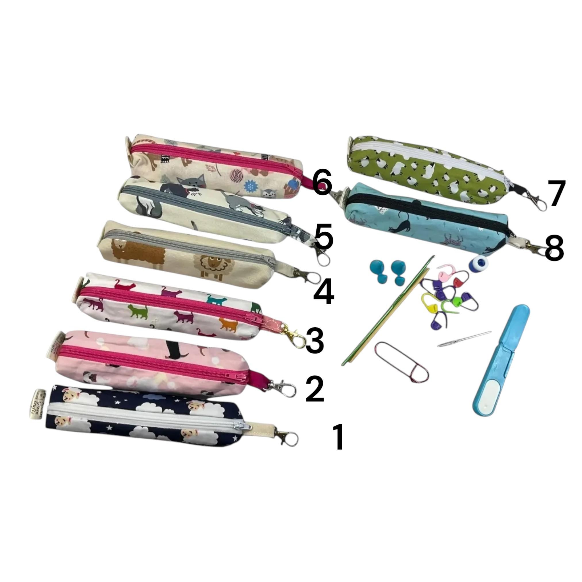 Knitting and crochet travel notions kit filled with accessories,  handy clip on knit bag travel kit, stitch markers, travel scissors,