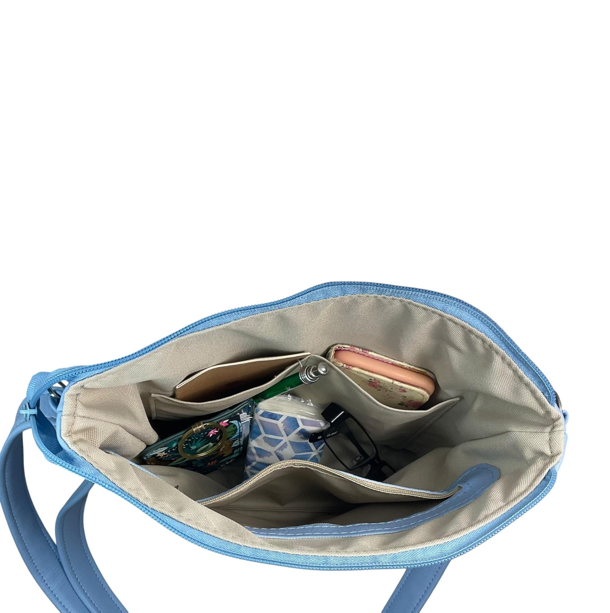 Handbag in faux Leather and floral wisteria print  fabric, medium sized zip top shoulder crossbody