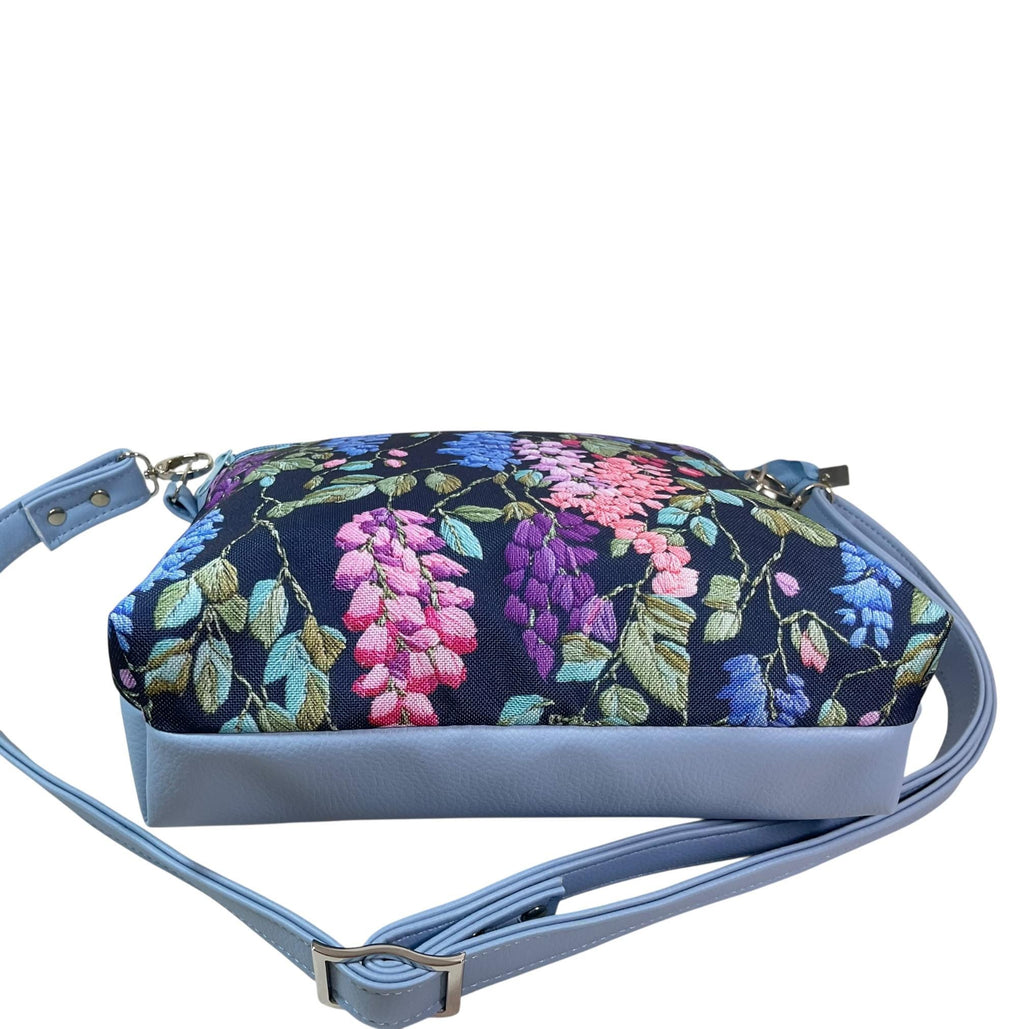 Handbag in faux Leather and floral wisteria print  fabric, medium sized zip top shoulder crossbody