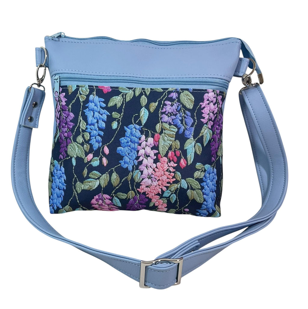 Handbag in faux Leather and floral wisteria print  fabric, medium sized zip top shoulder crossbody