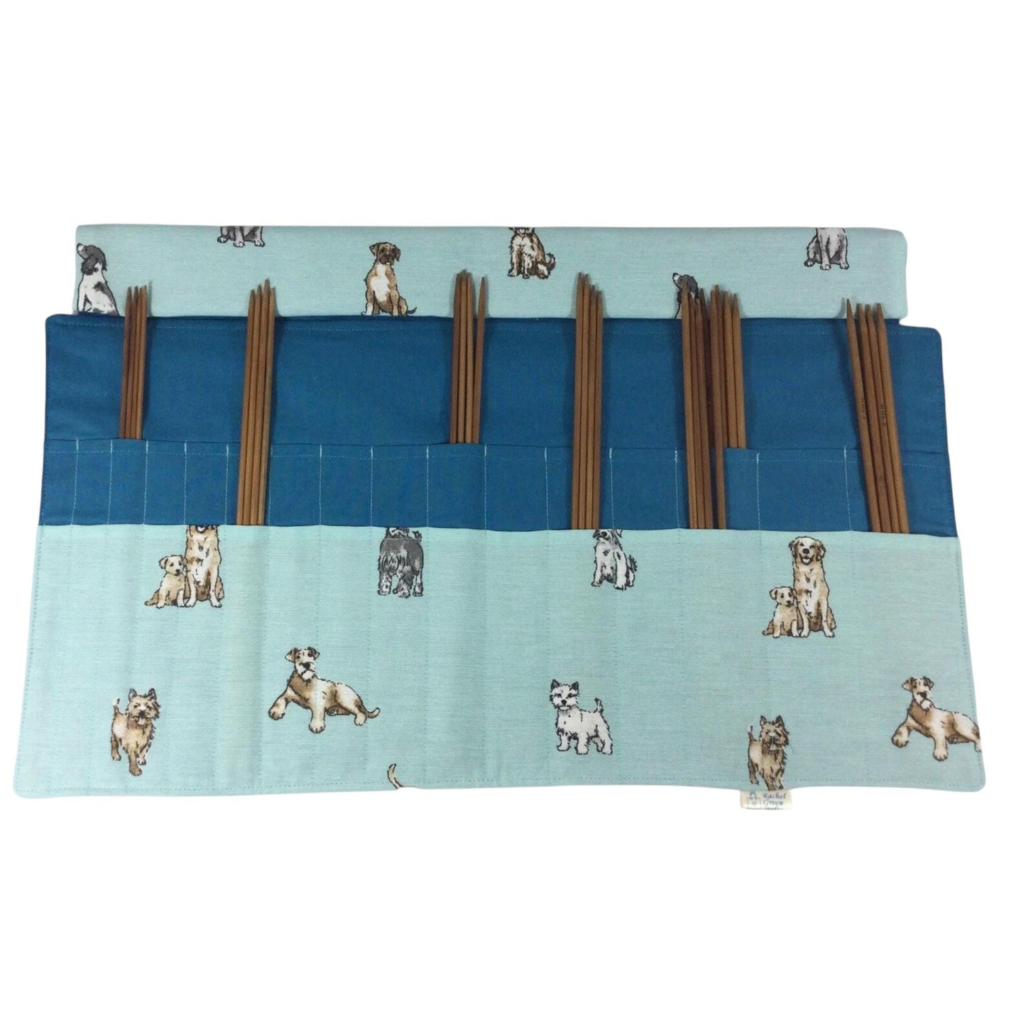 Double pointed knitting needle case with dogs