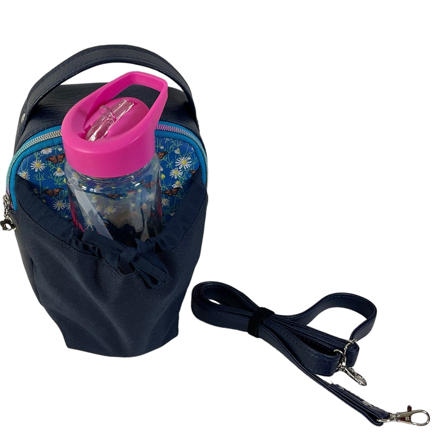Water bottle sling bag,  walking tour and travel day trip,  floral butterfly bag with carry handle, water resistant vinyl/ faux leather bag