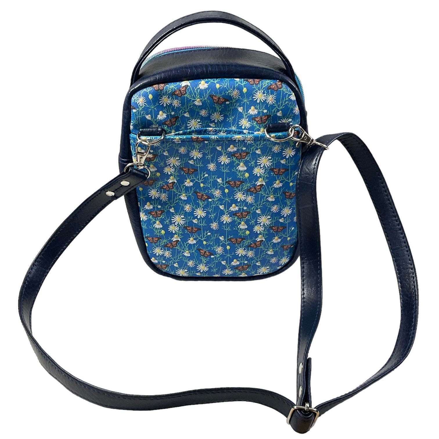 Water bottle sling bag,  walking tour and travel day trip,  floral butterfly bag with carry handle, water resistant vinyl/ faux leather bag