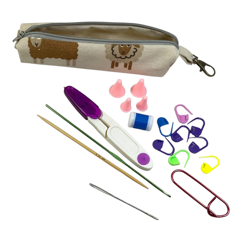 Knitting and crochet travel notions kit filled with accessories,  handy clip on knit bag travel kit, stitch markers, travel scissors,